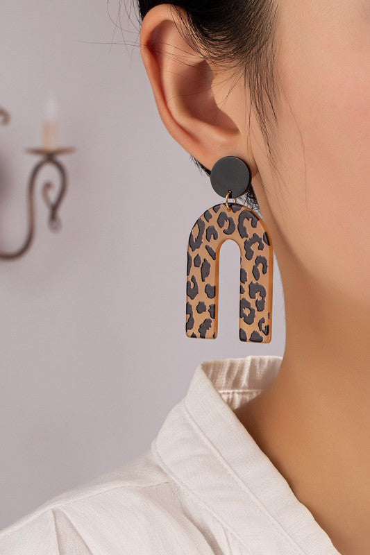 Embossed animal print arch drop earrings