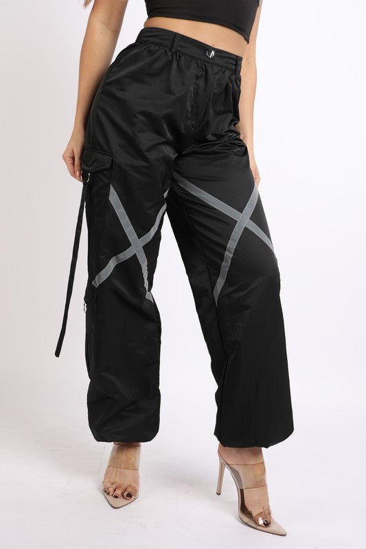 Windbreaker pants with reflective detail